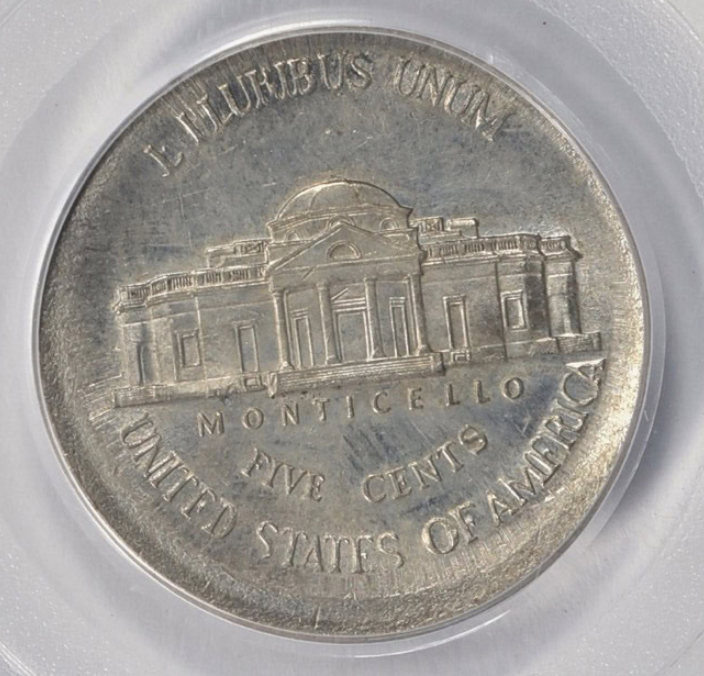 2013 nickel broadstrike error showing expanded diameter and flat edge compared to normal nickel